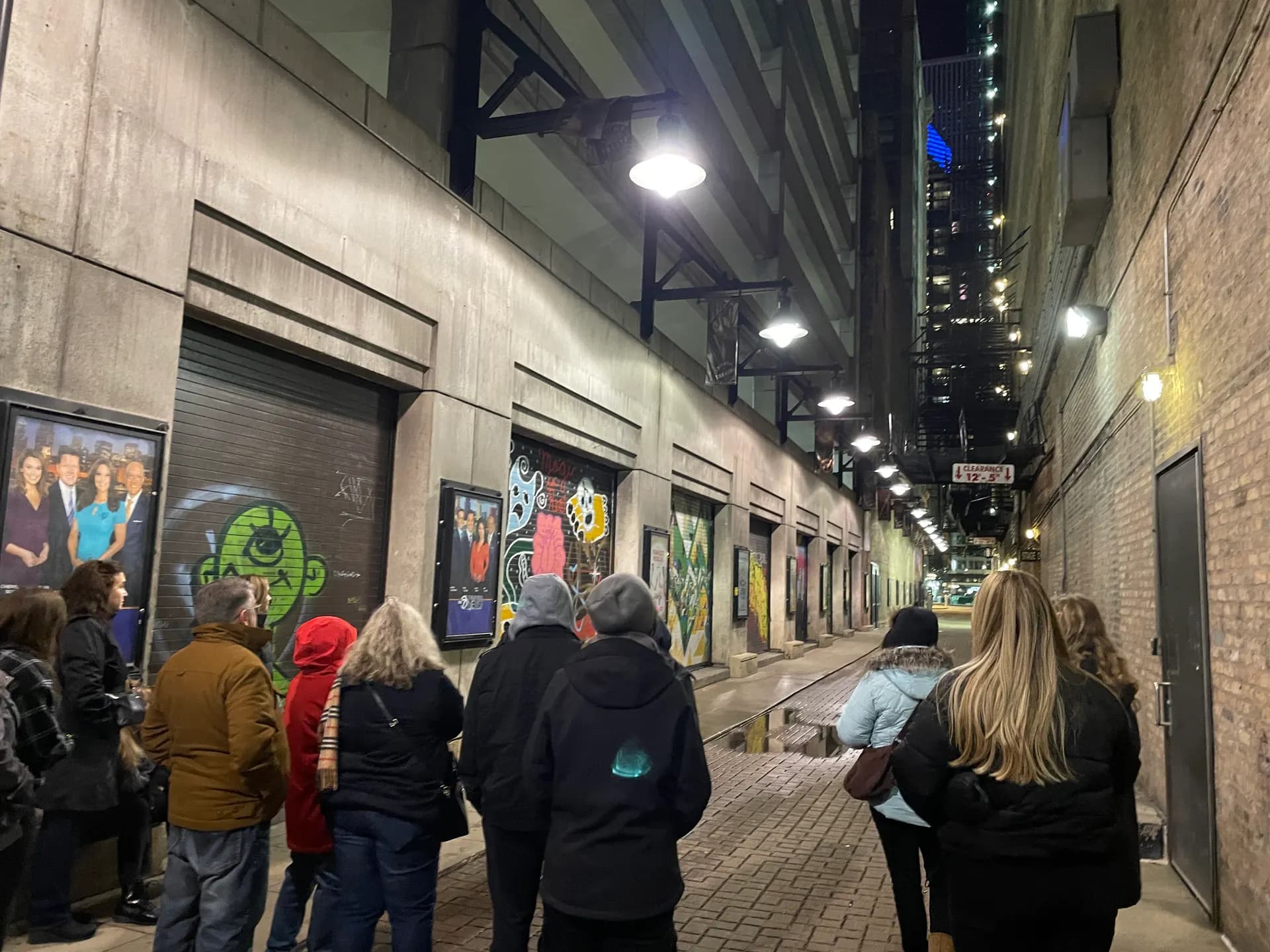 Guests gathered in the alley behind the Nederlander Theatre, site of the Iroquois Theatre Fire, on the Chicago ghost tour