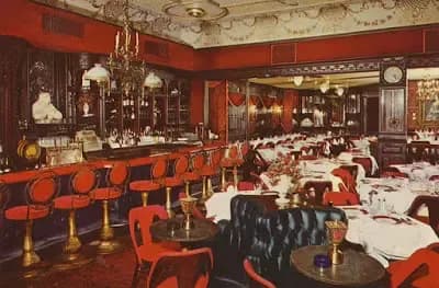 A restaurant with tables and chairs and a bar