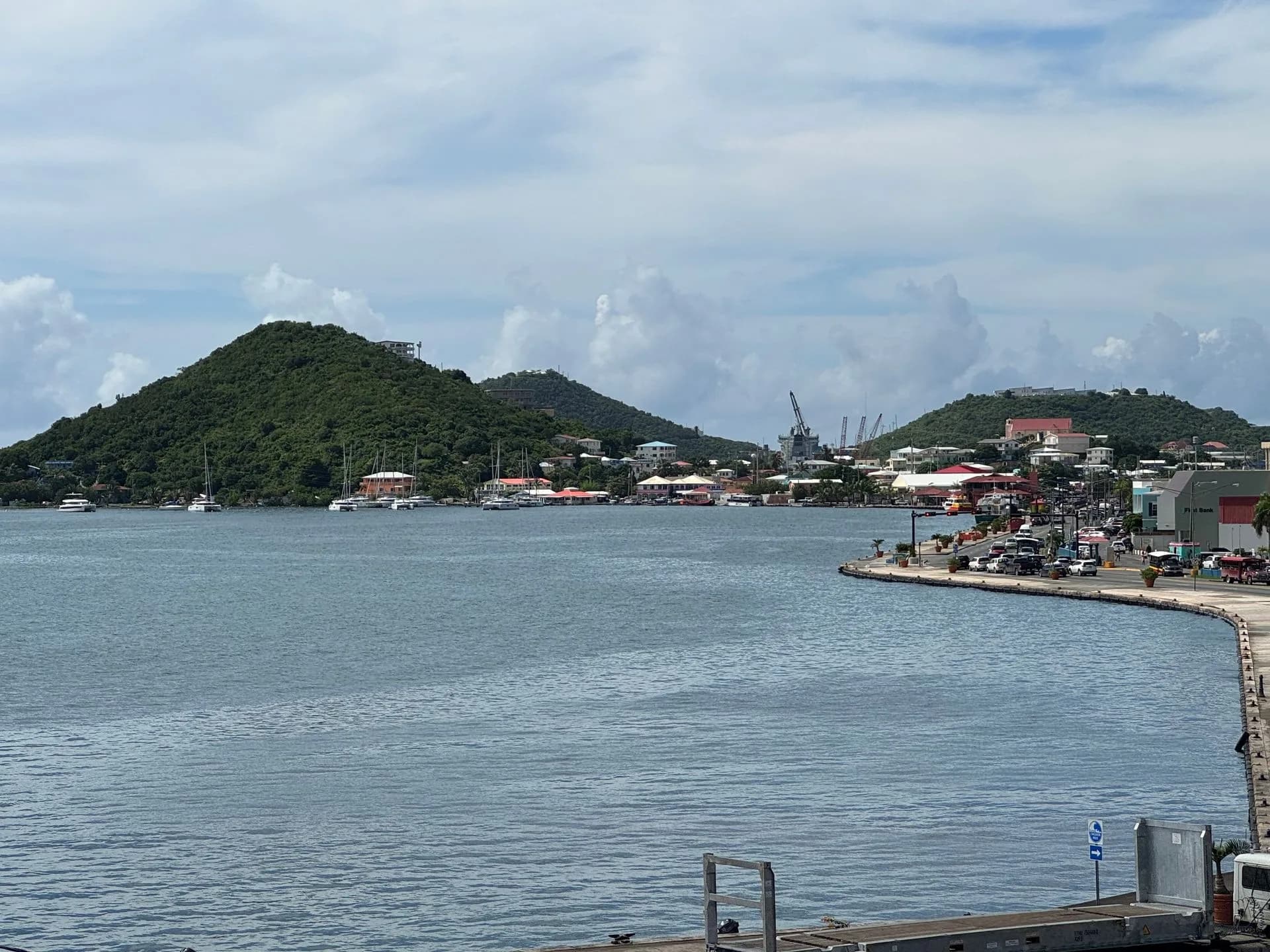 A large body of water with a mountain in the background