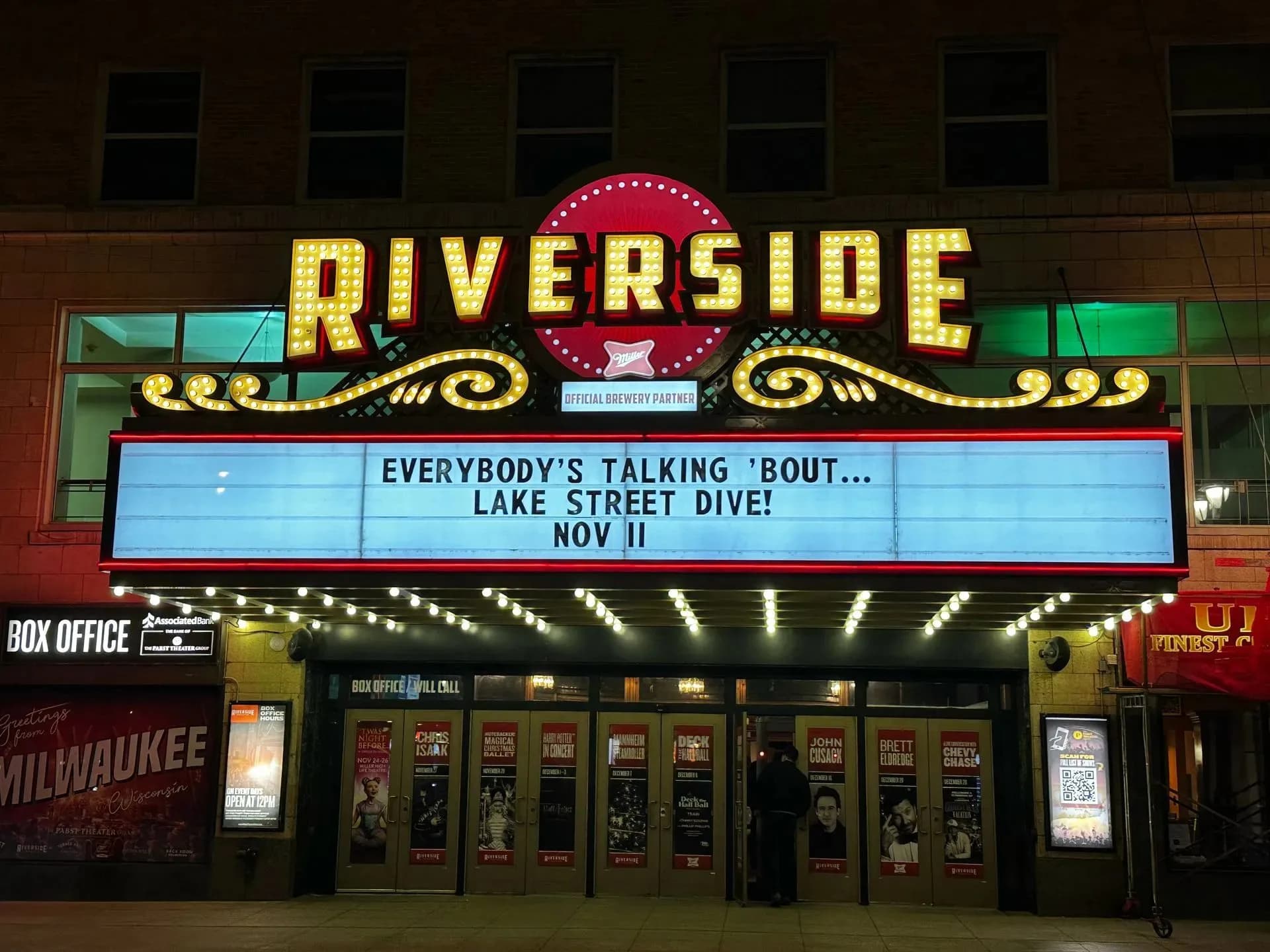 Riverside Theater marquee lit up at night in downtown Milwaukee