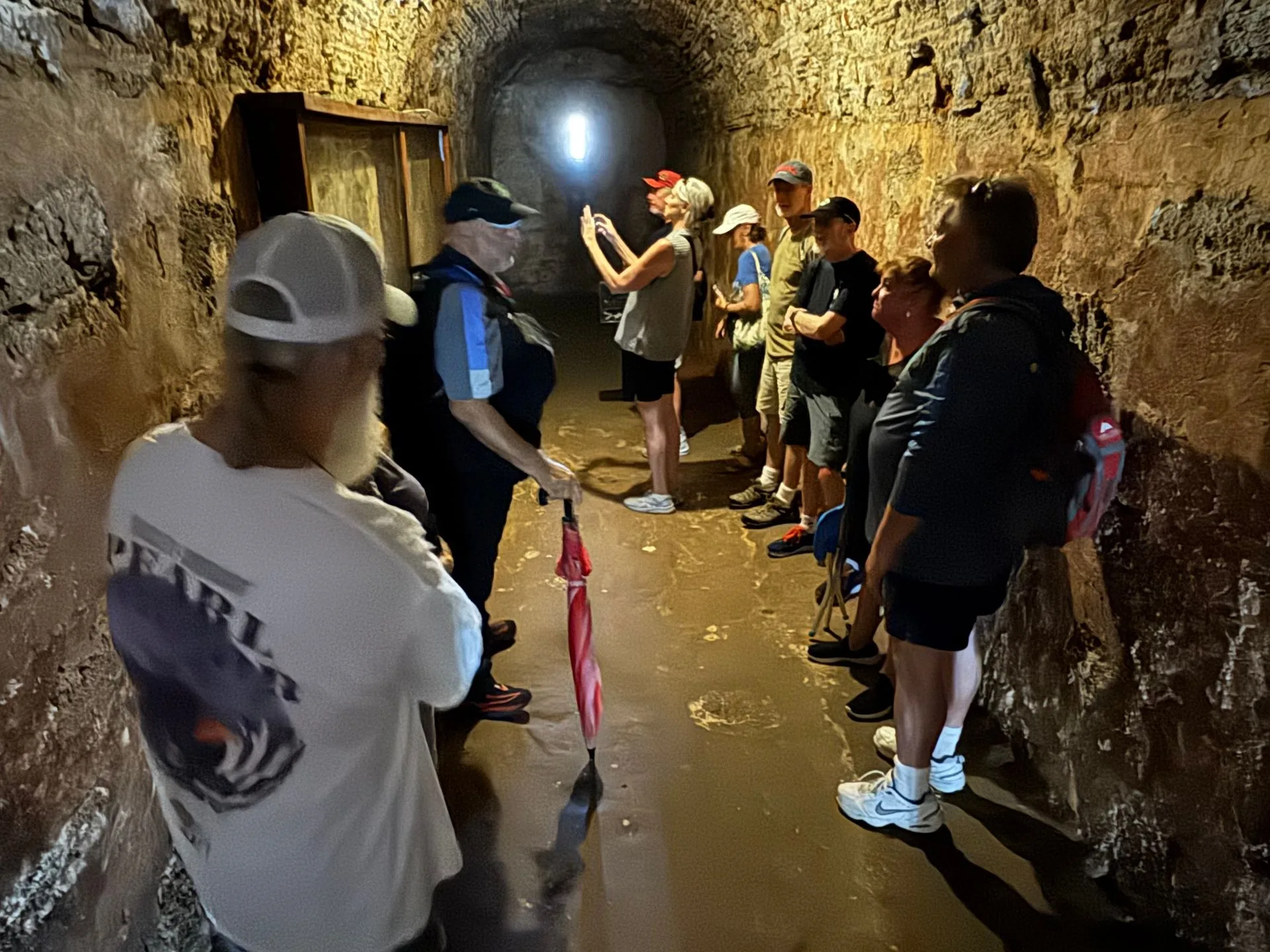 Exploring a dungeon in San Cristobal fort on a ghost walk in San Juan, Puerto Rico