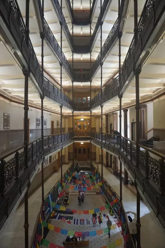 A large building with a lot of windows and a colorful floor.