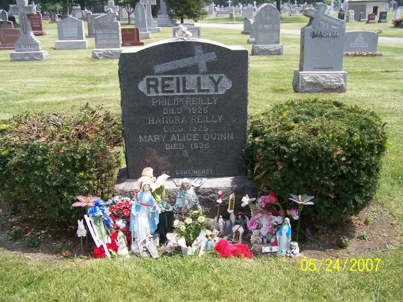 A grave in a cemetery with the name reilly on it