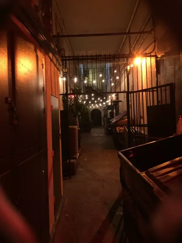 A dark hallway with a truck in the middle of it