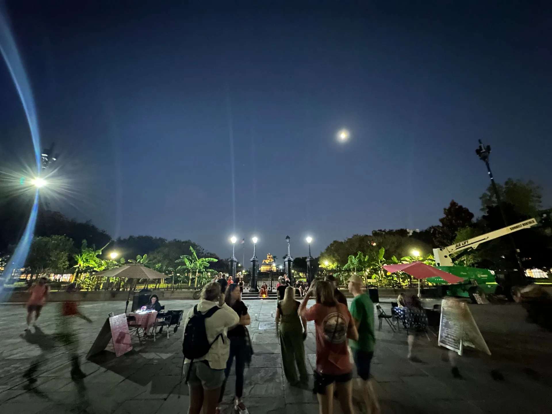 People gather in the square at nighttime