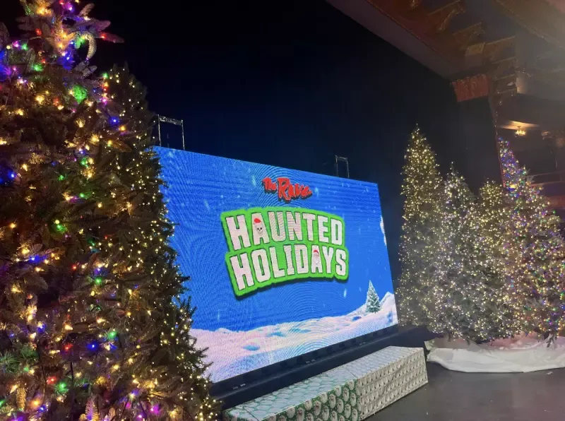 A large screen with the words haunted holidays on it