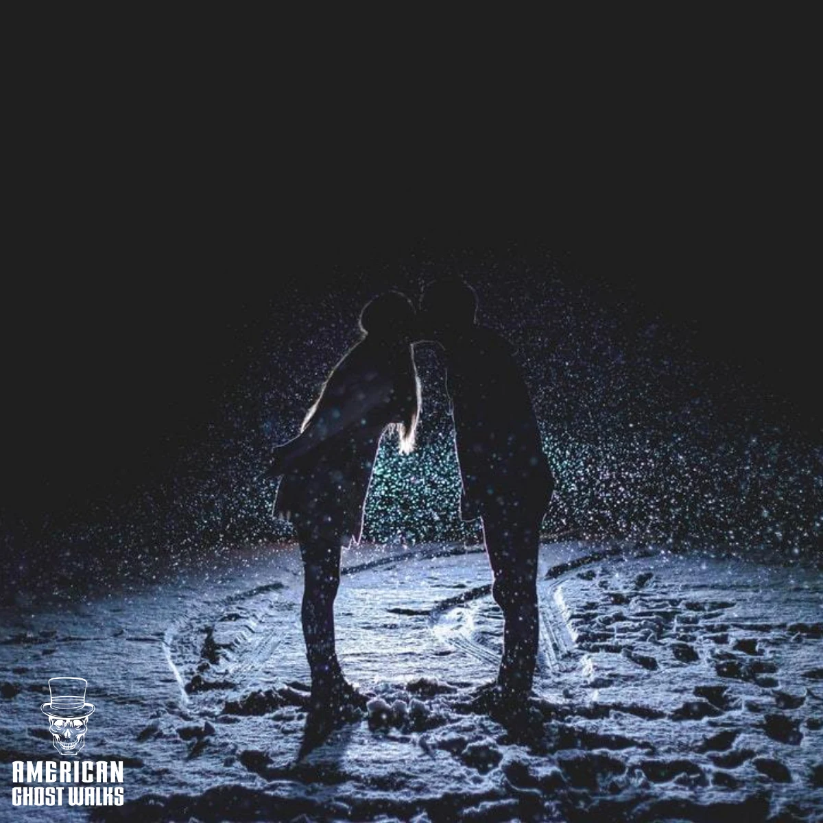A man and a woman are kissing in the snow.