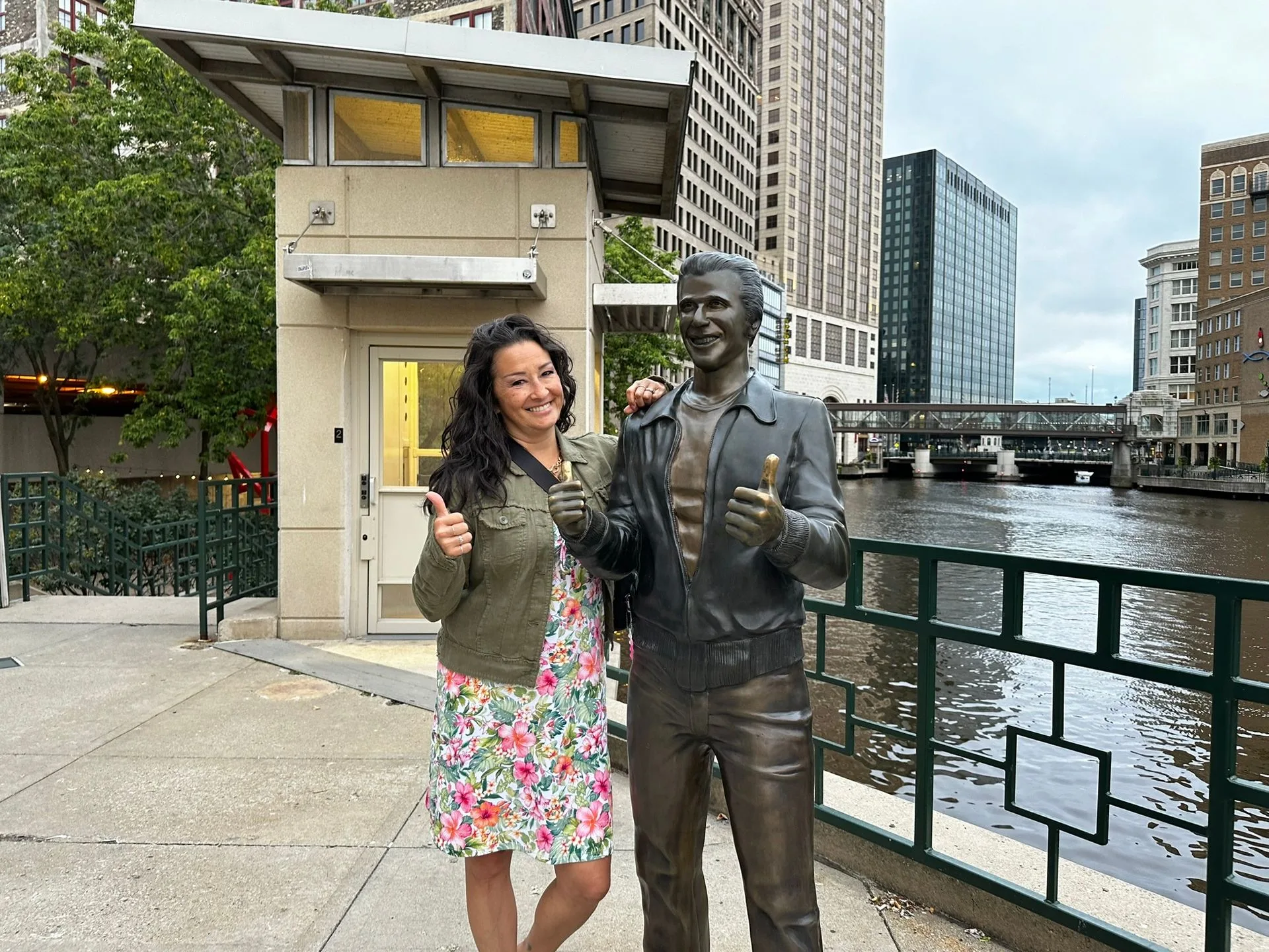 A happy ghost hunter visiting with the Bronze Fonz on our Shadow of City Hall Ghost Tour