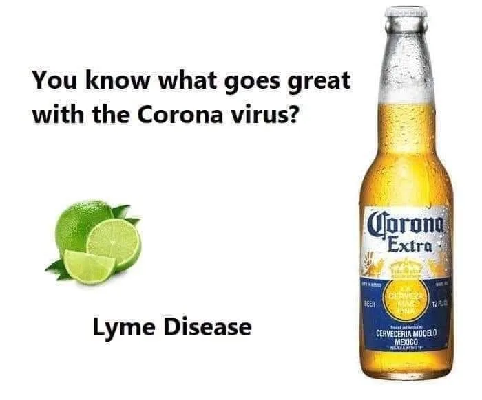 A bottle of corona extra beer next to a lime