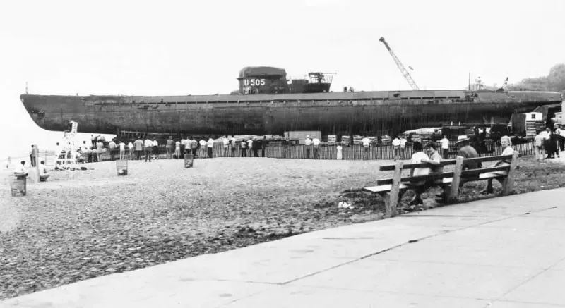 A black and white photo of a boat in the water