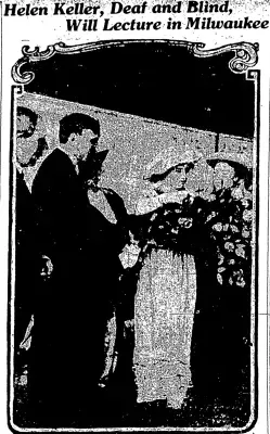 A black and white photo of a man and woman standing next to each other.