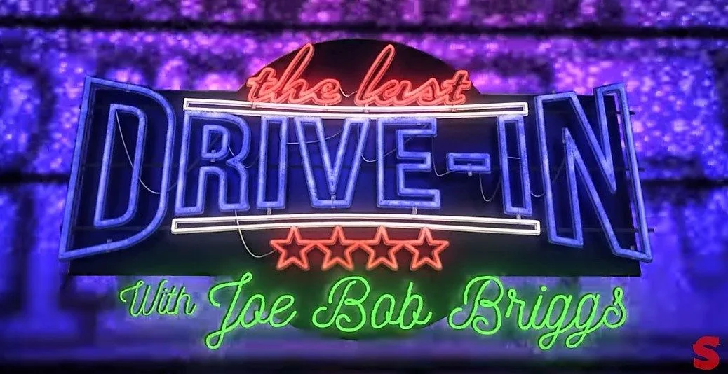 A neon sign that says drive-in with joe bob briggs