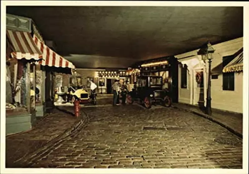 A black and white photo of a cobblestone street