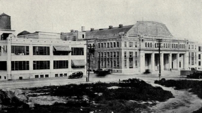 A black and white photo of a large building