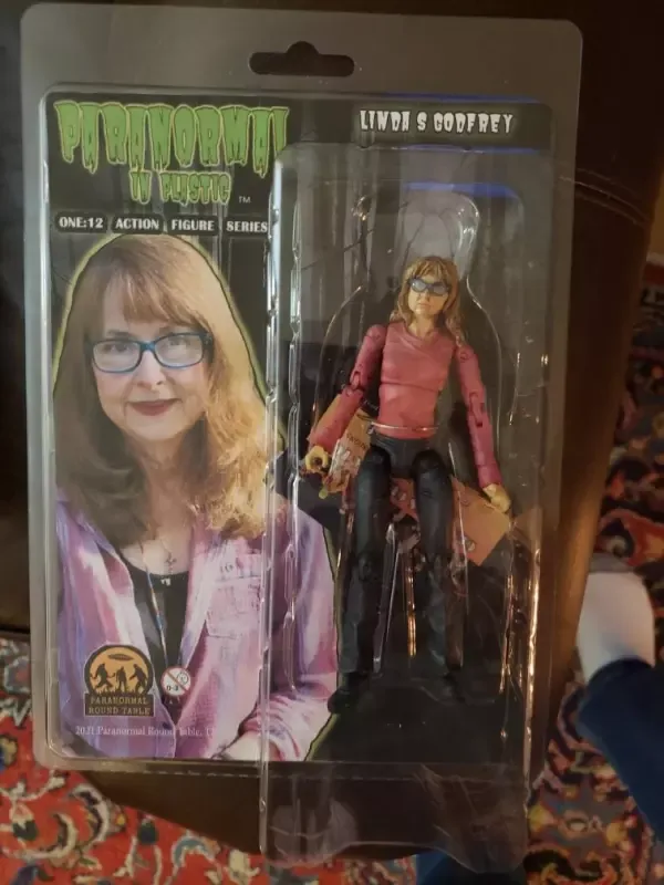 A doll with a picture of a woman on it
