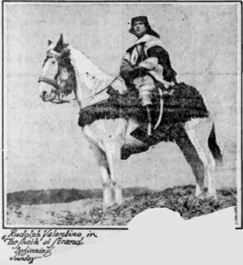 A black and white photo of a man riding a horse