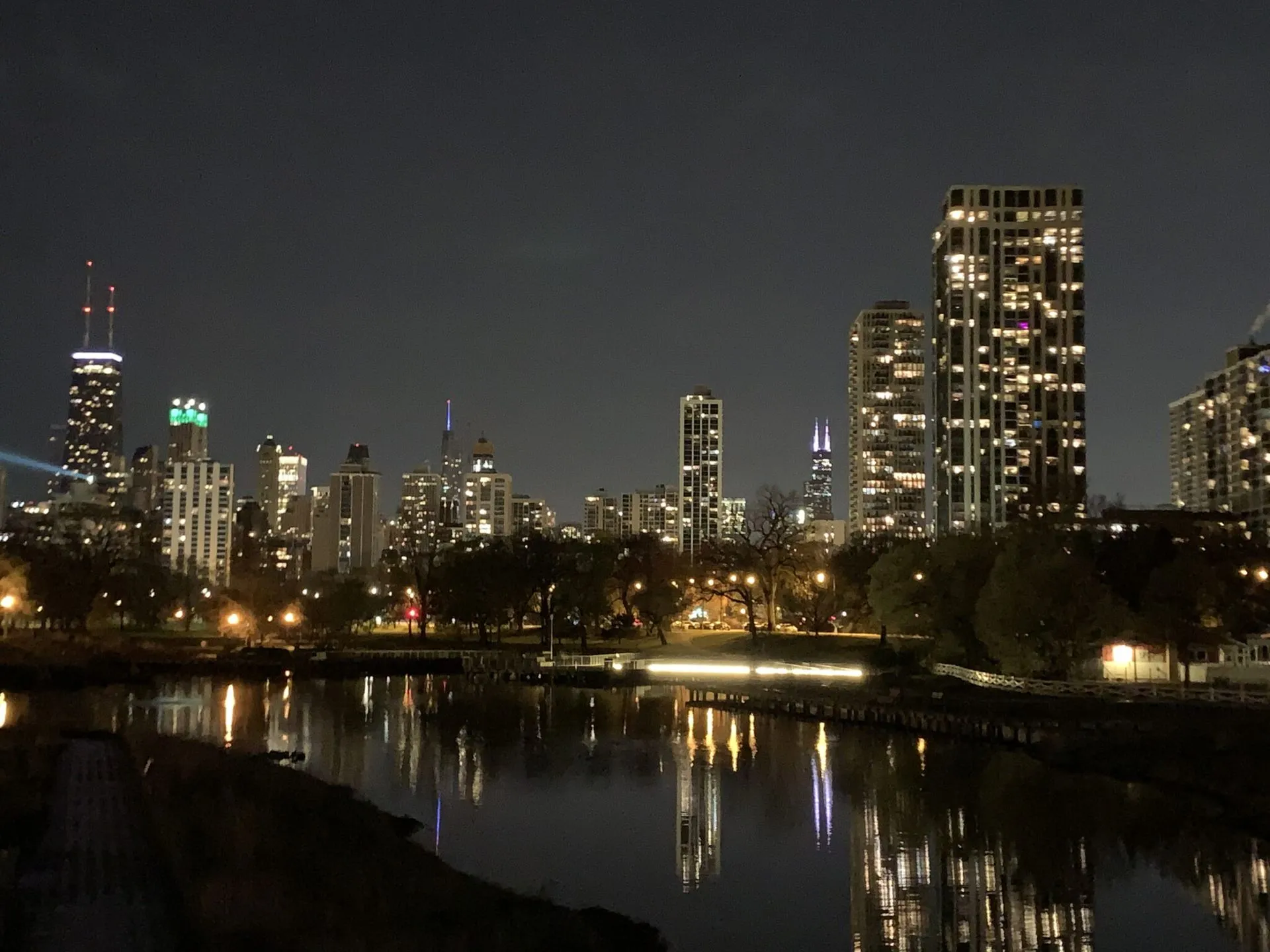 Chicago skyline reflected in the Lincoln Park Lagoon at night