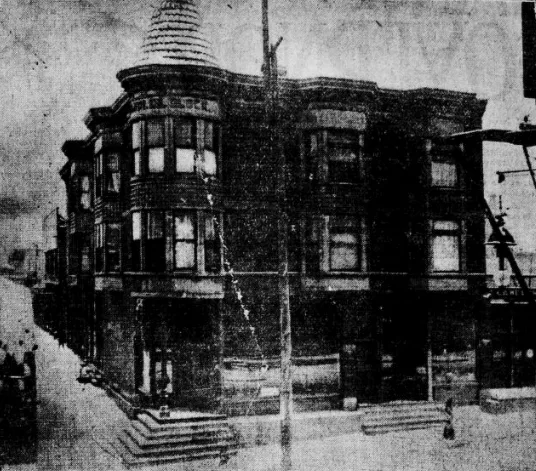 A black and white photo of a large brick building