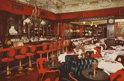 A restaurant with tables and chairs and a bar