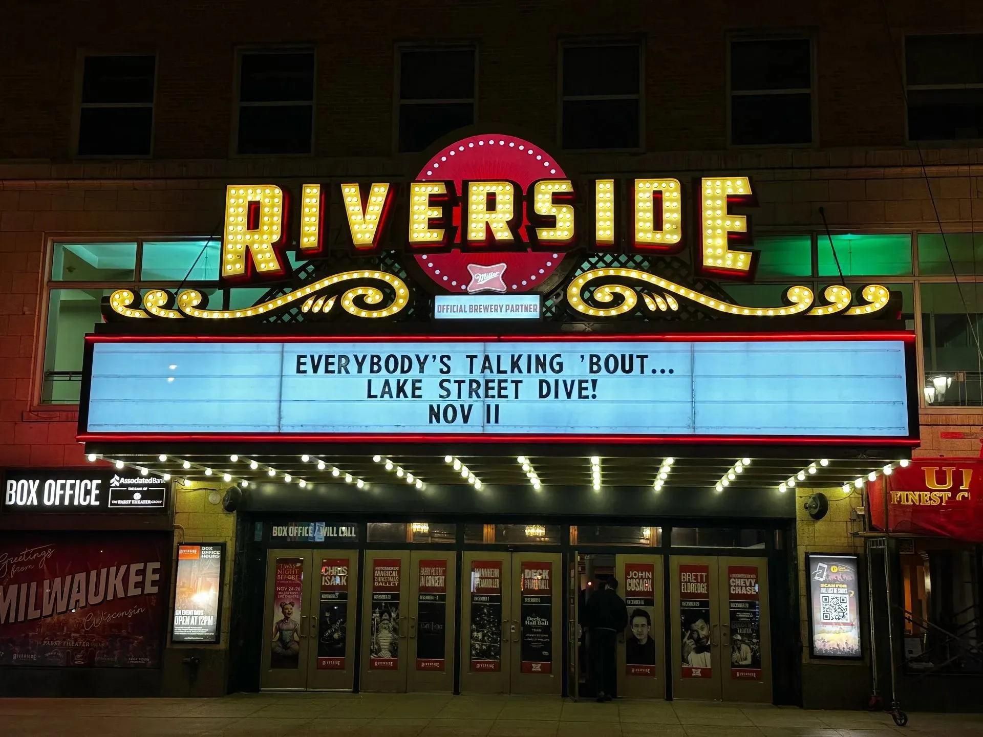 Riverside Theater marquee lit up at night in downtown Milwaukee